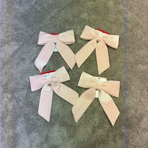 NWT velvety blush bows 
Set of 4